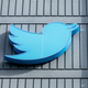 The Twitter logo is seen on a sign on the exterior of Twitter headquarters in San Francisco, California, on October 28, 2022.